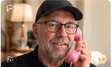 Lifestyle image of man using pink RetroCall handset